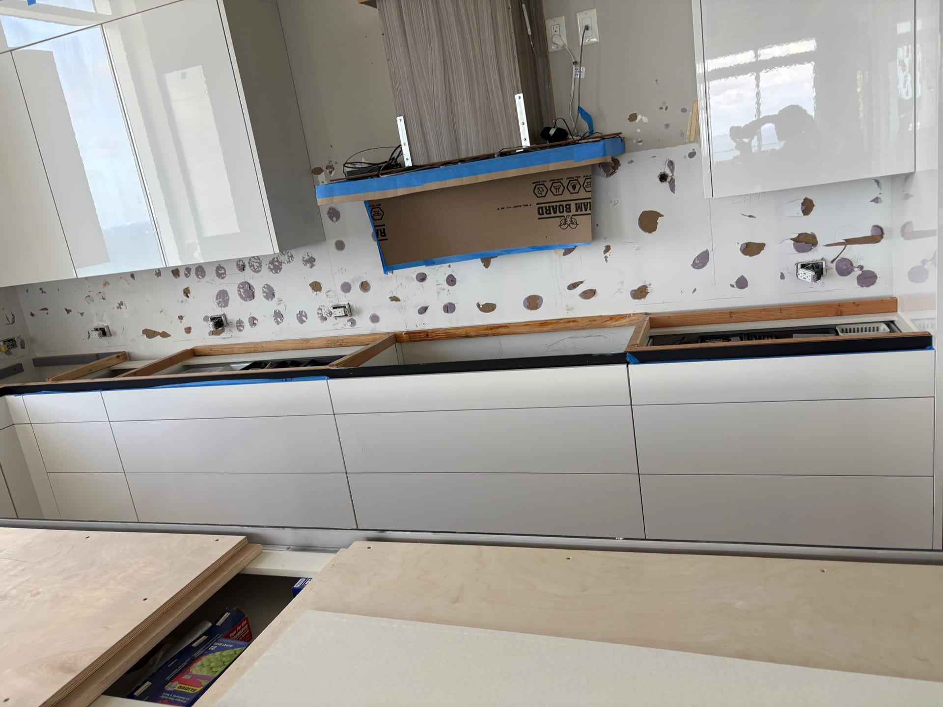 Walls prepped for a full-height stone backsplash